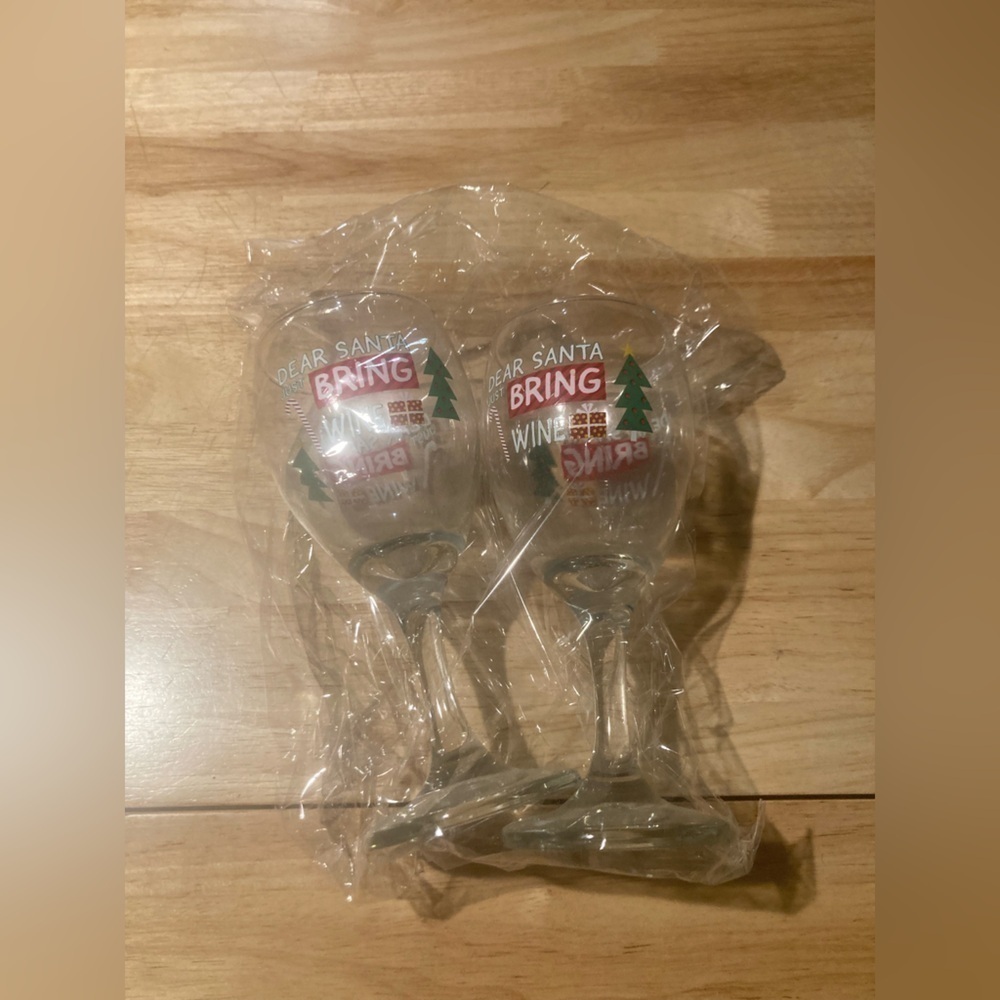 4/$25 Christmas wine glasses that say Dear Santa bring wine. Never used